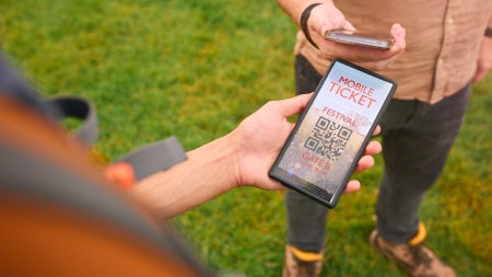  Close  up of a person showing an E-ticket on a mobile phone