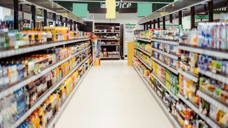 Photo of a beverage aisle in a store with labels blurred
