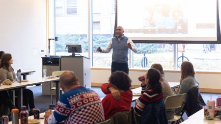 A professor talks to students during a class