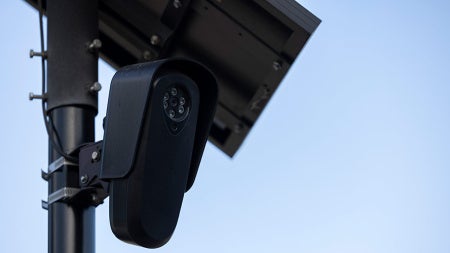 Close up photo of an AI-driven security camera on a post