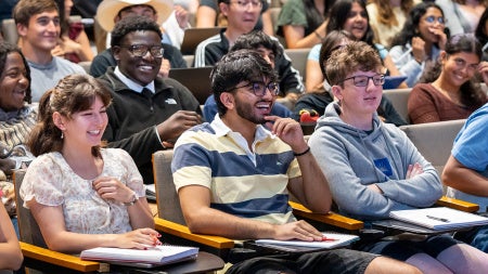 Students smile and laugh in a class lecture at CWRU