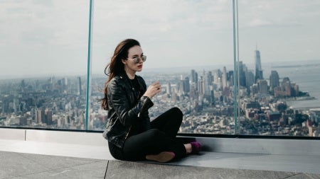 Elizabeth A. Davis with the New York City skyline in the background