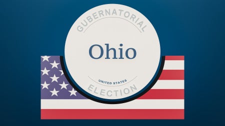 Image of a Ohio gubernatorial election banner with American flag in the background