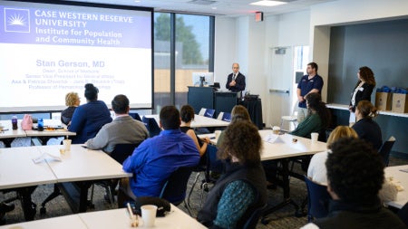 Dean Gerson presents to attendees at the IPCH open house