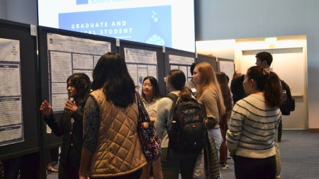 students presenting at research day
