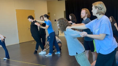 Students rehearsing Romeo and Juliet in a room