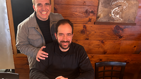 Photo of Adam Paulisick and John Pastor smiling