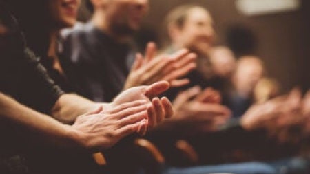 Several people clapping their hands