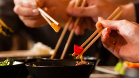 Young-people-eating-in-Thai-restaurant-