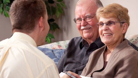 elderly-couple-talking-to-advisor