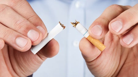 man-breaking-cigarette