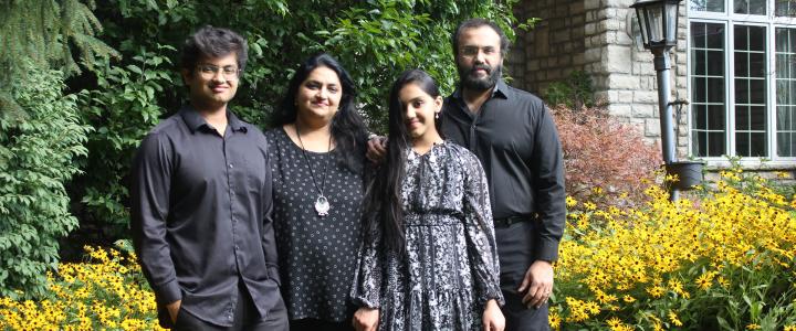 A family poses for a group photo