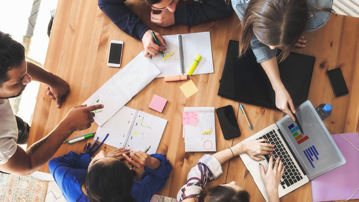Image of students working together at a table