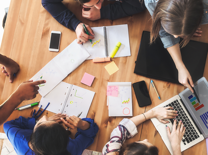 Image of students working together at a table