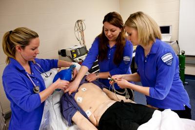 Photo of CWRU FPB students receiving instruction on a dummy patient.