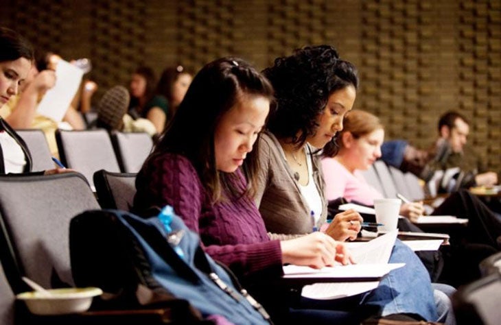Picture of CWRU grad students taking notes during class