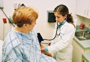 Picture of a Nurse taking a woman's blood pressure.