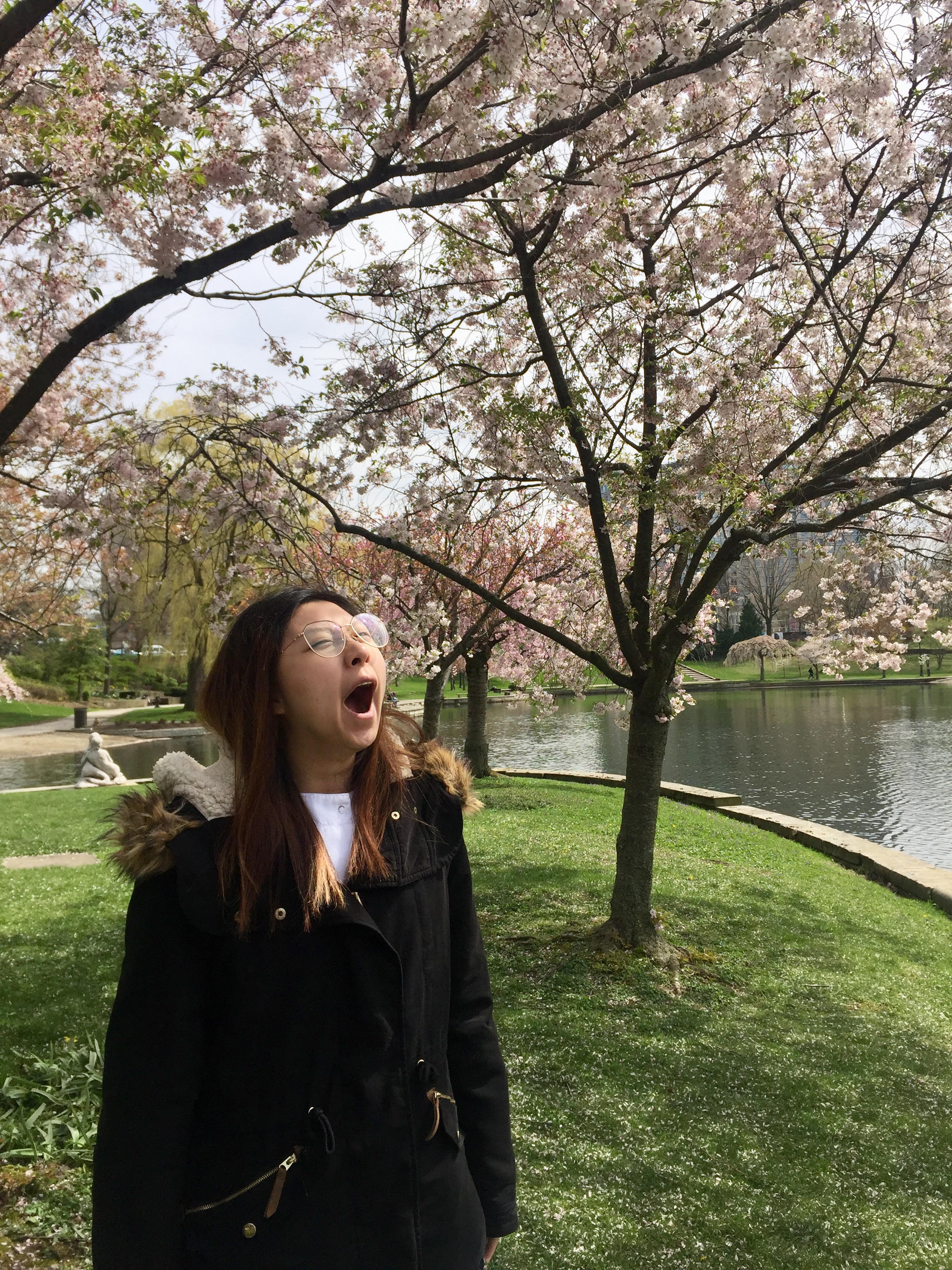 BSN student takes a fresh air break under the cherry blossoms after an 8-hour OR clinical shift with the Frances Payne Bolton School of Nursing at Case Western Reserve University in Cleveland, Ohio.