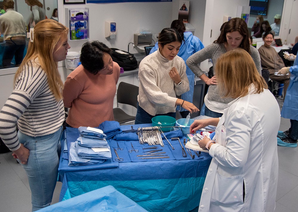 Students participate in mock surgery lab class