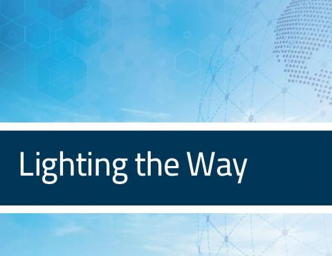 Blue background with the headline, "Lighting the Way" written in white typeface.