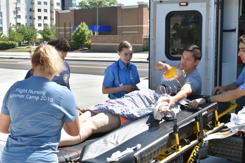 Students in a critical care transport nursing simulation at the 2019 Flight Summer Camp.