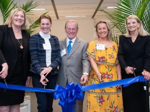 Members of the nursing faculty and Shaughnessy family cutting a ribbon