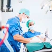 Stock photo of a nurse and doctor intubating a patient.