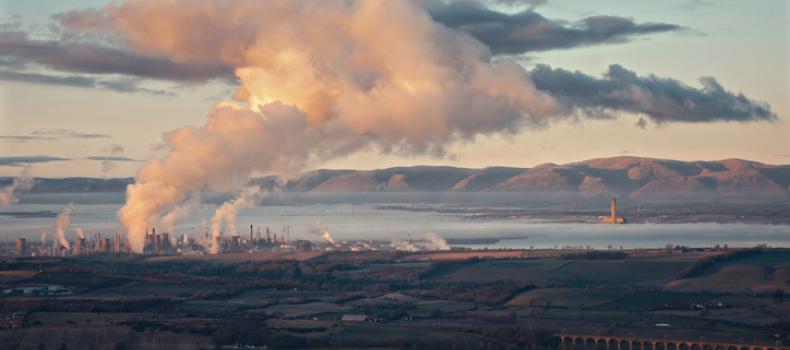 Panorama of Grangemouth petrochemical works and big cloud of smoke. Refinery from the Bathgate Hills. The Avon Viaduct. The Firth of Forth. Grangemouth, Scotland