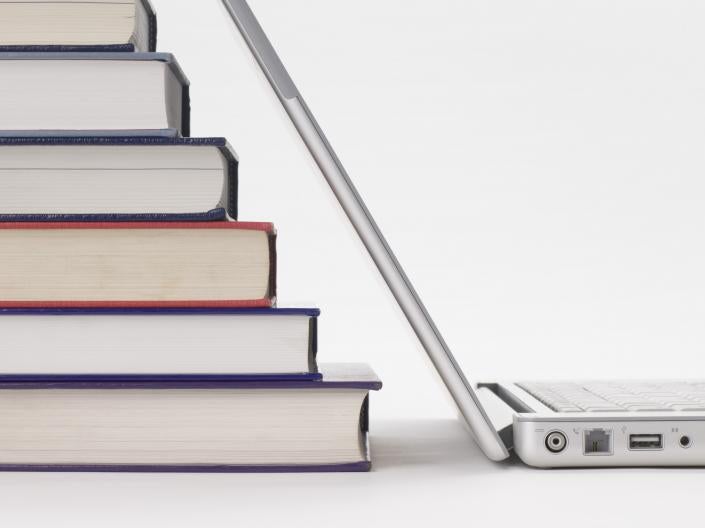 Stock photo of books and laptop computer
