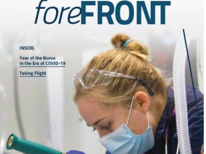 Forefront Magazine Cover - Nurse peering into equipment