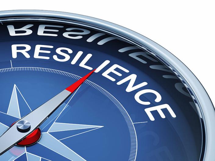Navigational compass with the word "resilience" on it.