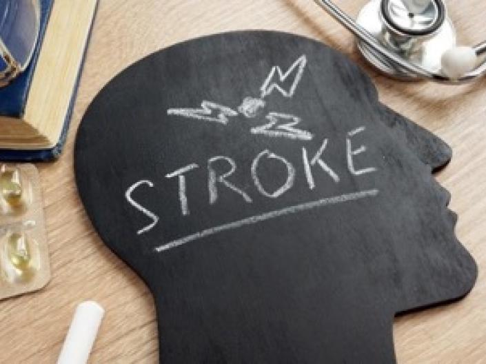 A chalkboard shaped like a human head with "Stroke" written on it.