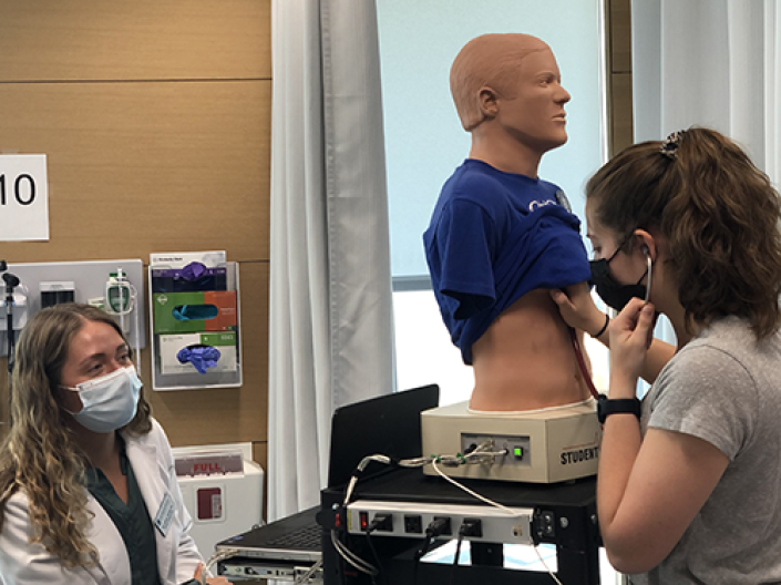 nursing students in an abdominal lab