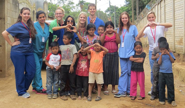Picture of CWRU FPB students posting with young citizens of Guatemala.
