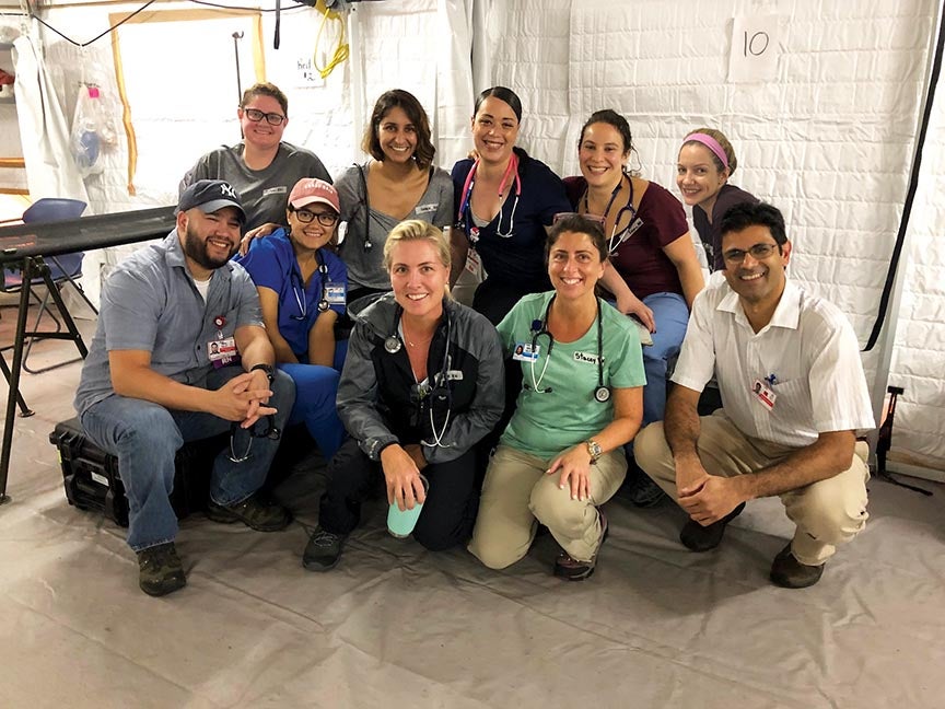 Team One medical volunteers in Fajardo, Puerto, Rico, front row, from left: Juan Baez, RN; Melanie Pratts, RN; Christine Mahoney, MS, RN; Stacey A. Conklin, MSN, MS, RN; and Kevin Munjal, MD; back row, from left: Colleen Fischer, RN; Karendip Kaur Braich, MD; Helen Rosario, RN; Emma Kaplan-Lewis, MD; and Erin Hogan, RN.