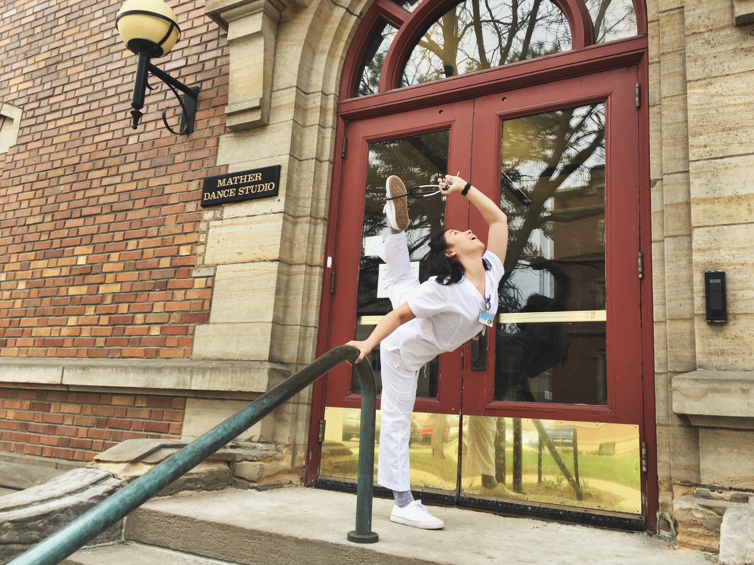 Sabrina Santander, nursing and dance double major, pictured with her stethoscope outside Mather Dance Center.