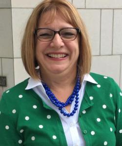 Headshot of Deborah Dillon smiling.
