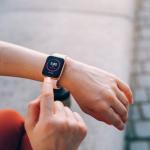 Smart watch on the wrist showing health vital signs