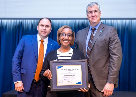 Quiana Howard, center, holding her Innovator of the Year award