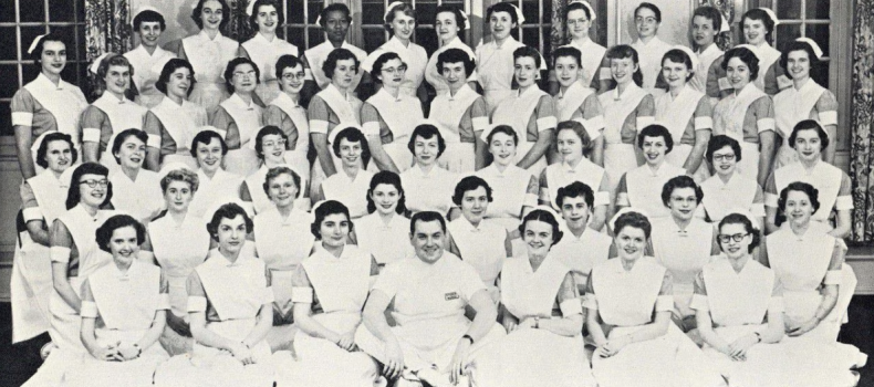 Class photo of nurses in white from 1956