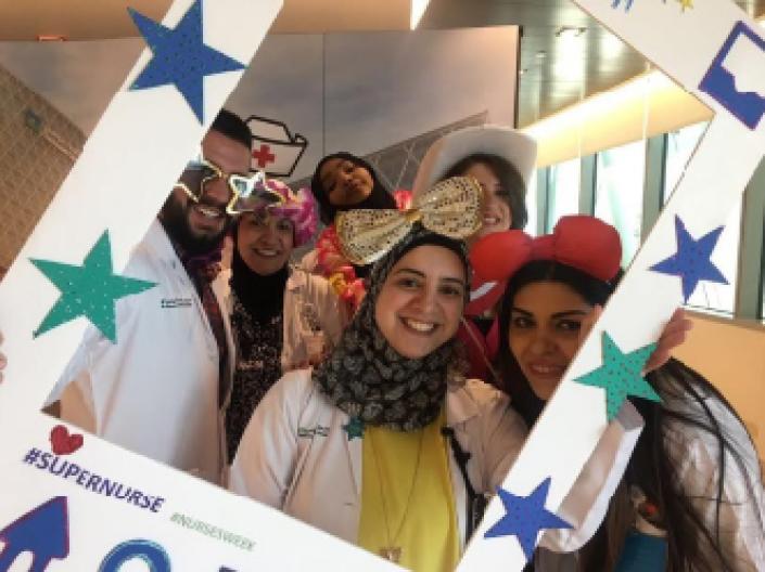 picture of students posing with fun props during nurses week.