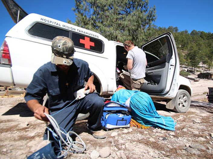 Eric Kramer with an offroad ambulance picking up a woman who had been in labor.