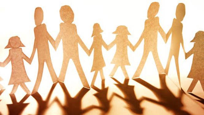 Paper people figures holding hands