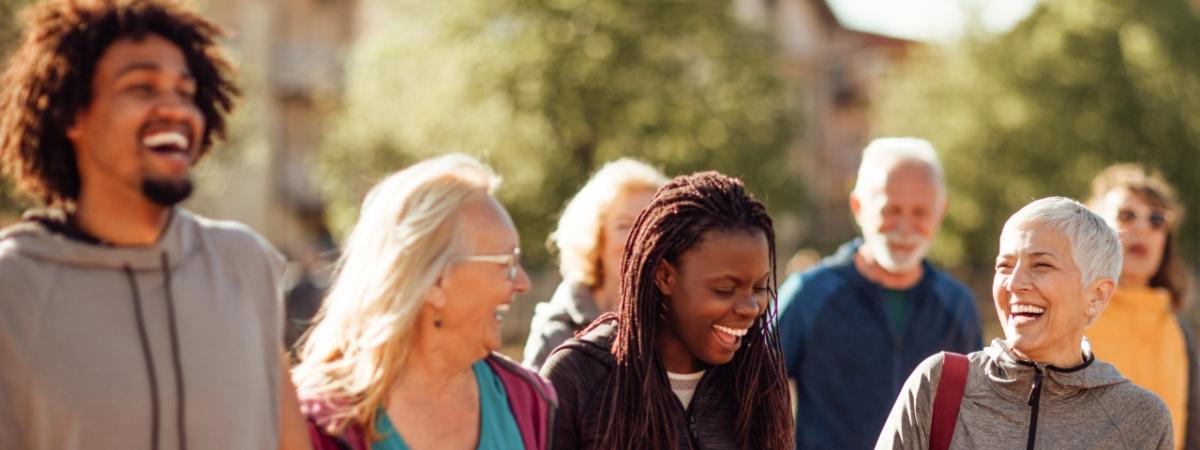 Smiling group of people walking together outdoors