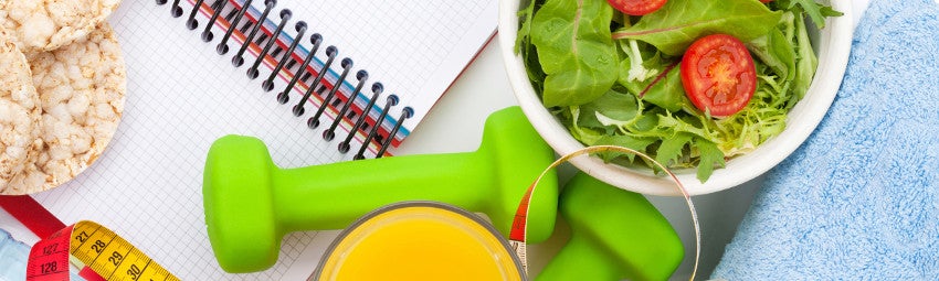 image depicting health lifestyle including weights and salad