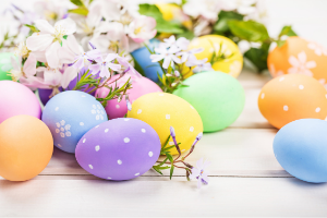 Colorful easter eggs on white table
