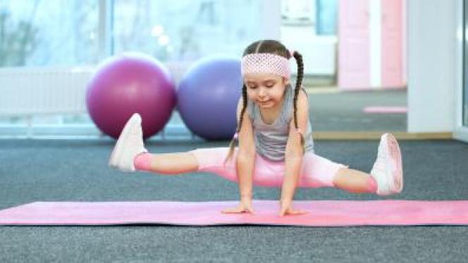 stock image of a young girl exercising