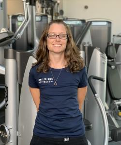 Melissa Parks standing in front of fitness equipment