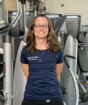 Melissa Parks standing in front of fitness equipment