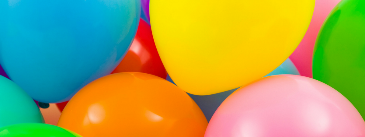close up of multi colored balloons